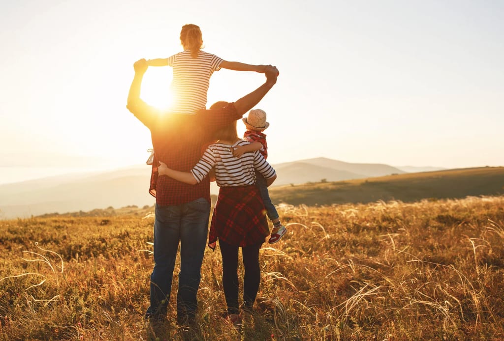 A family enjoying time together outdoors at sunset